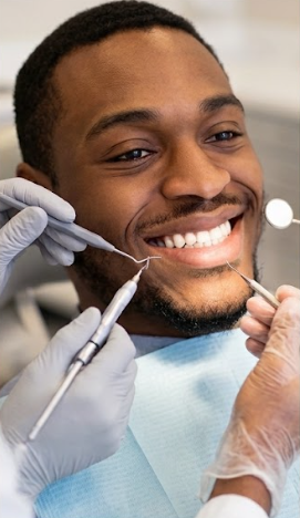 Adult receiving a dental examination