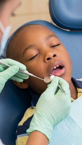Child receiving a dental checkup